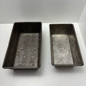 Set of 2 vintage Ovenex embossed metal starburst bread loaf pans; 9” and 9 3/4”